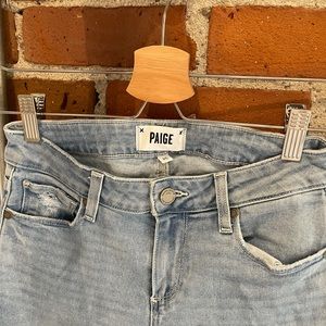 Light wash distressed blue Paige denim